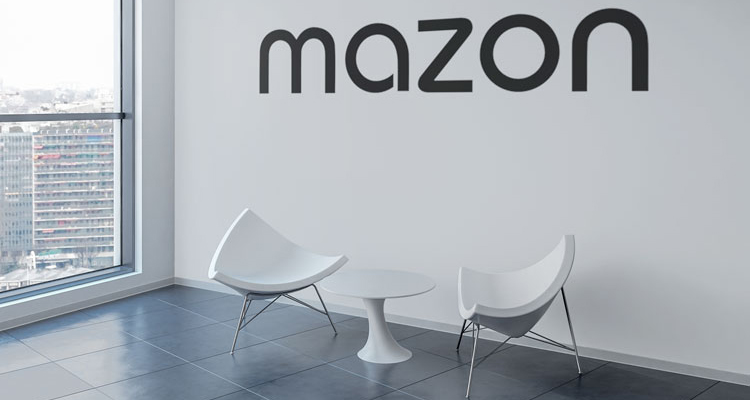 Odd shaped chairs in front of the Mazon sign